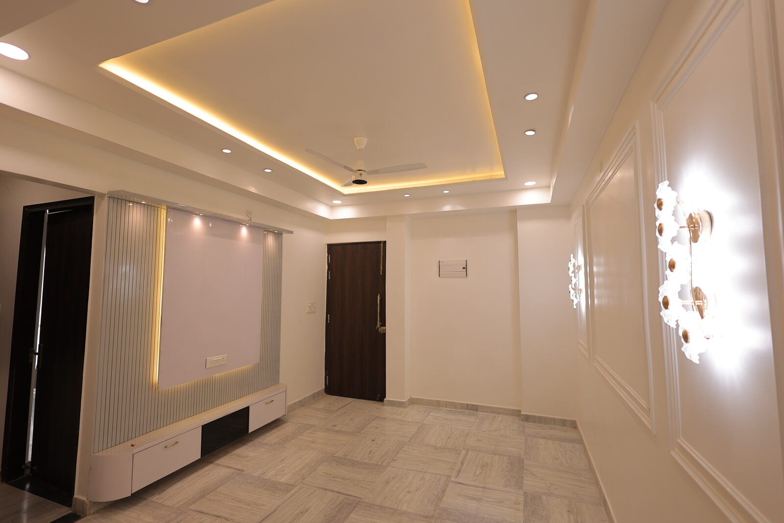 JJ Greens — interior living area with feature wall