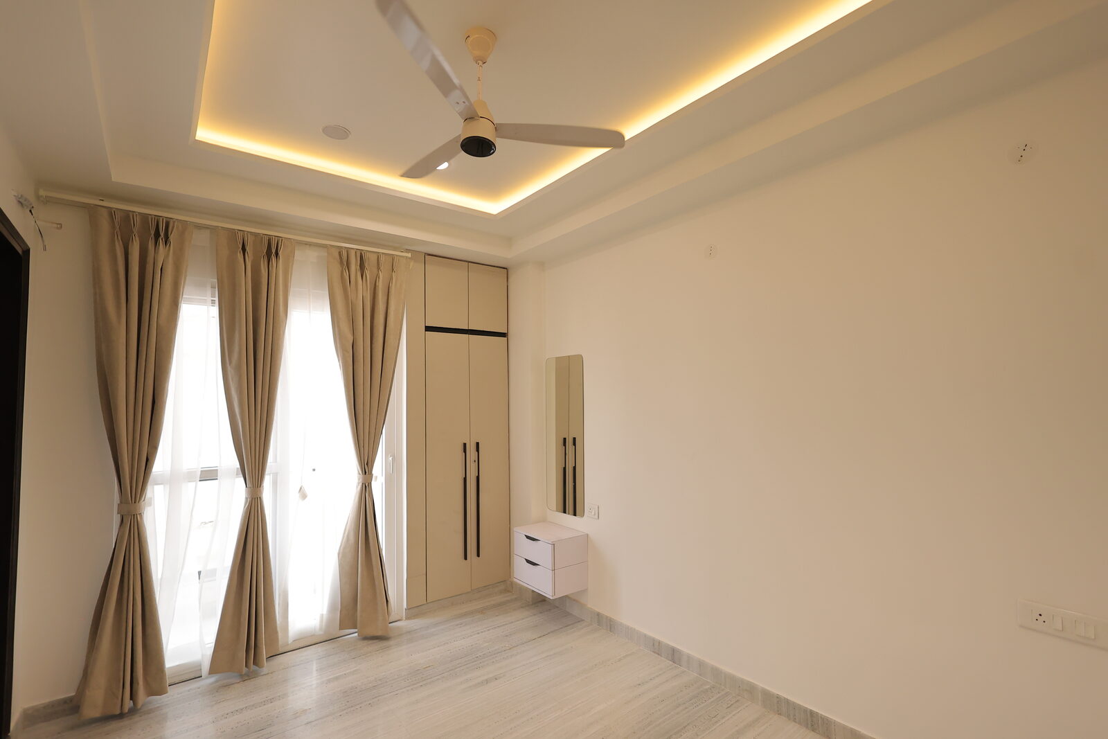 JJ Greens — bedroom with curtain detailing