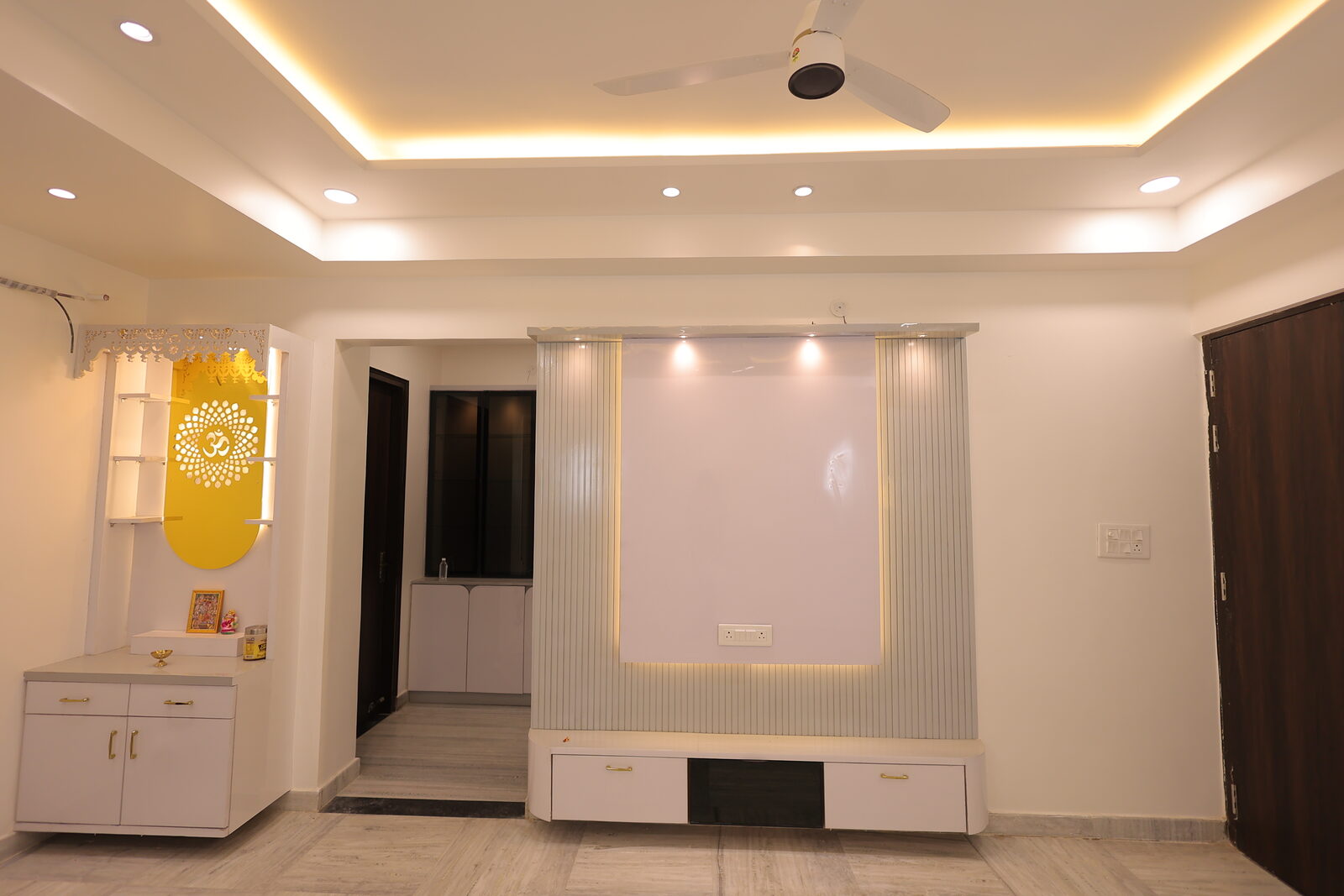 JJ Greens — living room with mandir alcove